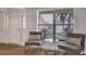 Entryway with light floors, gray chairs, and a stained-glass window detail at 107 17Th St, Belleair Beach, FL 33786