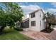 Well-maintained house with a brick patio and lush landscaping at 107 17Th St, Belleair Beach, FL 33786