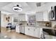 Bright kitchen with granite countertops and white cabinetry at 107 17Th St, Belleair Beach, FL 33786