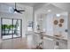 Modern kitchen with white cabinets, granite counters, and breakfast bar at 107 17Th St, Belleair Beach, FL 33786