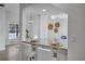 Kitchen features a breakfast bar with granite countertop and white cabinetry at 107 17Th St, Belleair Beach, FL 33786