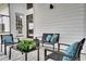 Cozy patio with modern furniture and lush greenery at 107 17Th St, Belleair Beach, FL 33786