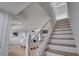 Bright staircase leading to the upper level at 107 17Th St, Belleair Beach, FL 33786
