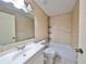 Bathroom features a bathtub, toilet and vanity at 11 Leaning Palm Ct, Plant City, FL 33563