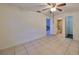 Spacious bedroom with tile flooring and an ensuite bathroom at 11 Leaning Palm Ct, Plant City, FL 33563