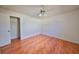 Bright bedroom with wood-look tile flooring and a ceiling fan at 11 Leaning Palm Ct, Plant City, FL 33563