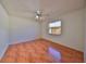 Spacious bedroom with wood-look tile and a window at 11 Leaning Palm Ct, Plant City, FL 33563