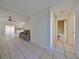 View of a hallway leading to living room and bathroom at 11 Leaning Palm Ct, Plant City, FL 33563
