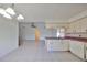 Open kitchen with a view of the living room and dining area at 11 Leaning Palm Ct, Plant City, FL 33563