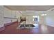 Galley kitchen with pink countertops and white cabinets at 11 Leaning Palm Ct, Plant City, FL 33563