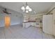 Kitchen features pink countertops, white cabinets, and tiled floors at 11 Leaning Palm Ct, Plant City, FL 33563