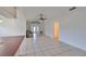 Open concept living room with tile floors and kitchen view at 11 Leaning Palm Ct, Plant City, FL 33563