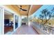 Private balcony boasting serene nature views and ceiling fan at 12055 Gandy N Blvd # 231, St Petersburg, FL 33702