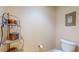 Small bathroom with a toilet and decorative shelf at 12055 Gandy N Blvd # 231, St Petersburg, FL 33702