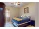 Comfortable bedroom with a queen-size bed and ceiling fan at 12055 Gandy N Blvd # 231, St Petersburg, FL 33702