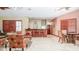 Community room with seating, tables, and a bar at 12055 Gandy N Blvd # 231, St Petersburg, FL 33702