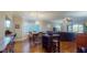 Open concept dining area with hardwood floors and chandelier at 12055 Gandy N Blvd # 231, St Petersburg, FL 33702