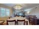 Bright dining room with table and chairs, offering view of living room at 12055 Gandy N Blvd # 231, St Petersburg, FL 33702
