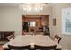 Elegant dining room with chandelier and view into kitchen at 12055 Gandy N Blvd # 231, St Petersburg, FL 33702
