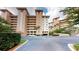 Exterior view of condo building with parking at 12055 Gandy N Blvd # 231, St Petersburg, FL 33702