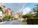 Exterior of condo building with lush landscaping and parking at 12055 Gandy N Blvd # 231, St Petersburg, FL 33702