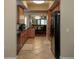 Kitchen with light wood cabinets and view of dining area at 12055 Gandy N Blvd # 231, St Petersburg, FL 33702