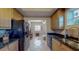 Modern kitchen with black appliances and granite countertops at 12055 Gandy N Blvd # 231, St Petersburg, FL 33702