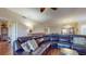 Open living room featuring a large sectional sofa and hardwood floors at 12055 Gandy N Blvd # 231, St Petersburg, FL 33702