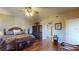 Bright main bedroom with king-size bed and built-in wooden cabinet at 12055 Gandy N Blvd # 231, St Petersburg, FL 33702