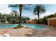 Relaxing pool area with palm trees and lounge chairs at 12055 Gandy N Blvd # 231, St Petersburg, FL 33702