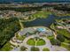 Aerial view of community clubhouse, pool, and golf course at 12132 Arron Ter, Trinity, FL 34655