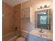 Clean bathroom featuring a tub, toilet and vanity with mirror at 1400 Gandy N Blvd # 715, St Petersburg, FL 33702