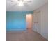 Bedroom with light blue accent wall and ceiling fan at 1400 Gandy N Blvd # 715, St Petersburg, FL 33702