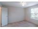 Simple bedroom with ceiling fan and window at 1400 Gandy N Blvd # 715, St Petersburg, FL 33702
