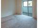 Bedroom with balcony access and carpet at 1400 Gandy N Blvd # 715, St Petersburg, FL 33702