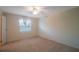 Bright bedroom with window, ceiling fan and neutral decor at 1400 Gandy N Blvd # 715, St Petersburg, FL 33702