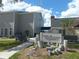 Windjammer clubhouse entrance with landscaping and seating at 1400 Gandy N Blvd # 715, St Petersburg, FL 33702
