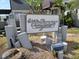 Windjammer Clubhouse sign with rustic wood design at 1400 Gandy N Blvd # 715, St Petersburg, FL 33702