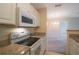 White appliances and granite countertops in kitchen at 1400 Gandy N Blvd # 715, St Petersburg, FL 33702