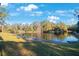 Serene pond with lush greenery and blue skies at 1400 Gandy N Blvd # 715, St Petersburg, FL 33702