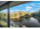 Scenic pond view with lush trees and a fountain at 1400 Gandy N Blvd # 715, St Petersburg, FL 33702