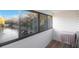 Bright sunroom with pond view and small table at 1400 Gandy N Blvd # 715, St Petersburg, FL 33702