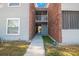 Walkway featuring a brick section and white railing for the second-floor units at 1400 Gandy N Blvd # 715, St Petersburg, FL 33702
