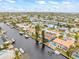Aerial view of waterfront community with canal and houses at 1409 Ne 49Th Ne Ave, St Petersburg, FL 33703