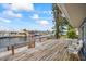 Wooden deck overlooks canal, with seating and view at 1409 Ne 49Th Ne Ave, St Petersburg, FL 33703