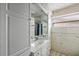 Clean bathroom with white vanity and tiled walls at 1409 Ne 49Th Ne Ave, St Petersburg, FL 33703