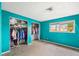Bedroom with double closets and teal walls at 1409 Ne 49Th Ne Ave, St Petersburg, FL 33703