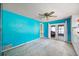 Bedroom with teal walls and sliding doors to patio at 1409 Ne 49Th Ne Ave, St Petersburg, FL 33703