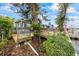 Home's exterior with deck and lush landscaping at 1409 Ne 49Th Ne Ave, St Petersburg, FL 33703