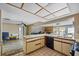Kitchen with ample cabinetry and a view into adjacent living area at 1409 Ne 49Th Ne Ave, St Petersburg, FL 33703